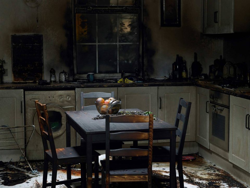 Charred scene shows need for fire damage restoration of kitchen furniture.