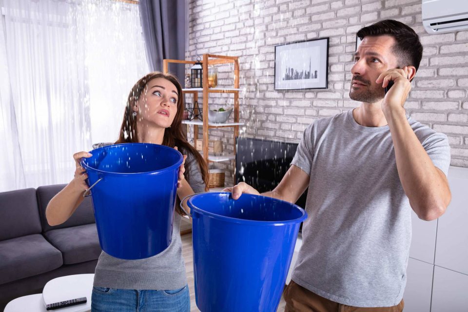 Lake City Restoration helps catch leaks in buckets indoors.