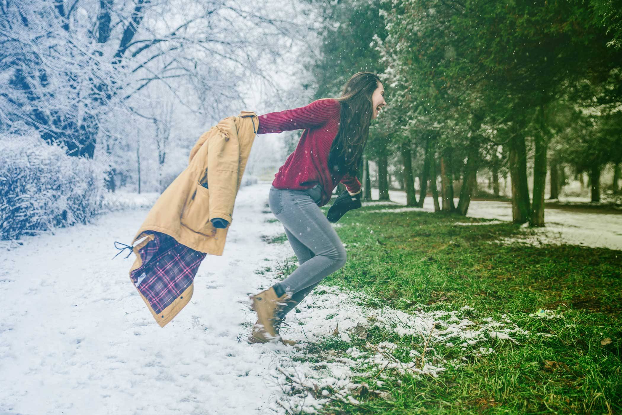 woman running from winter to spring